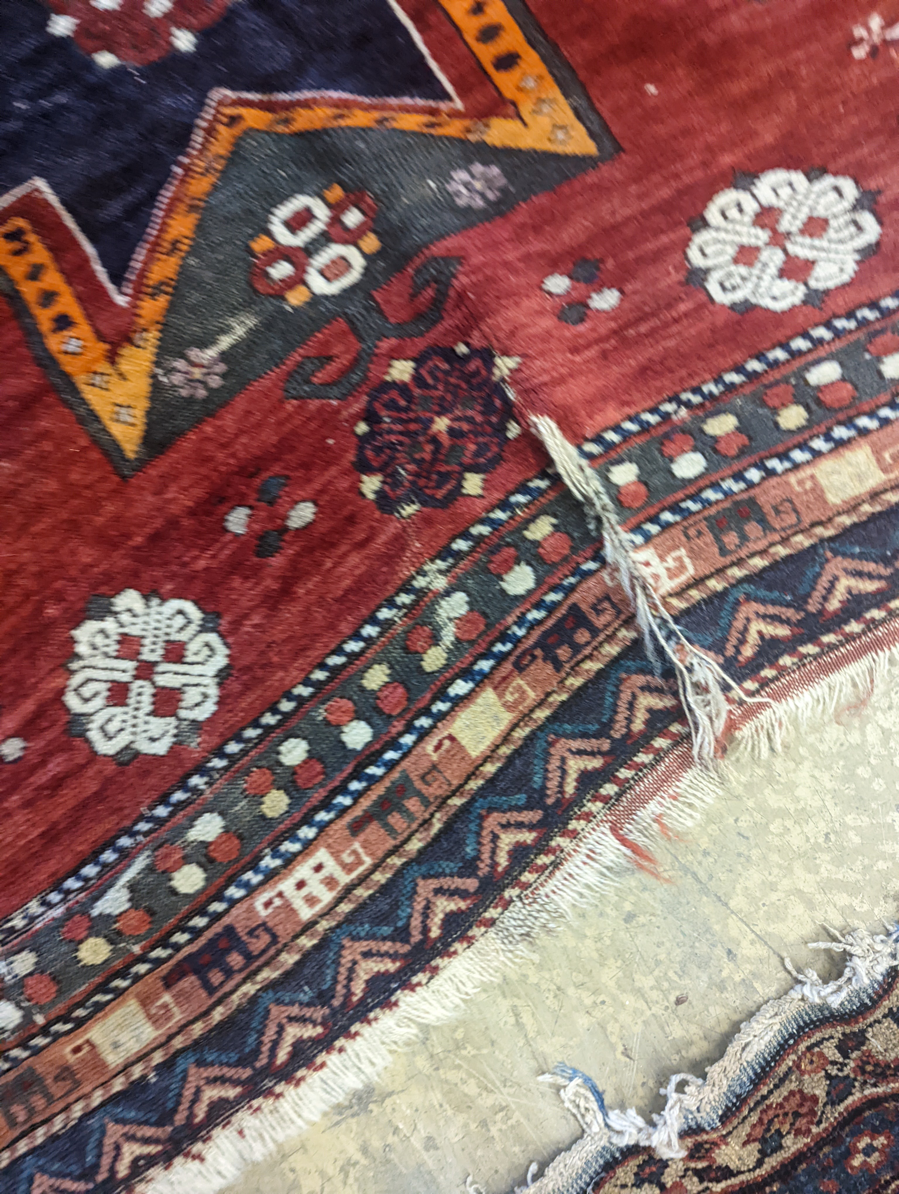 A Kazak red ground rug, 210 x 160cm